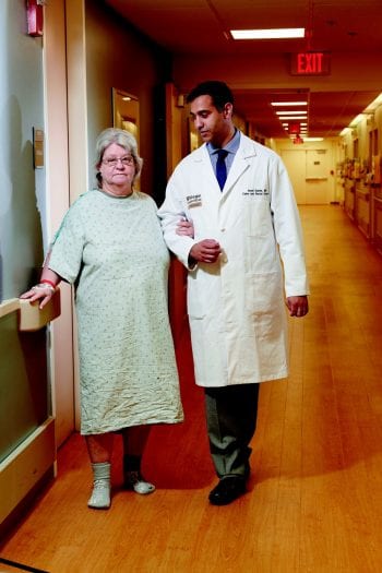 Dr. Damle walks with a patient to decrease higher rate of VTEs